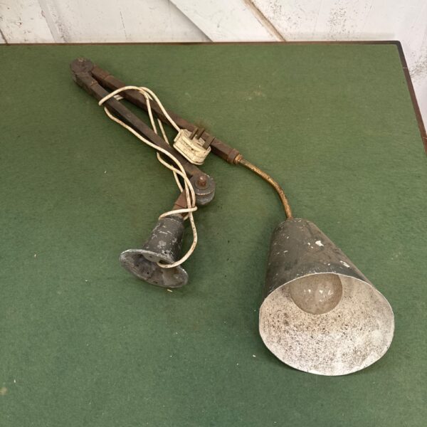 Vintage machinist bench lamp with adjustable metal arm.