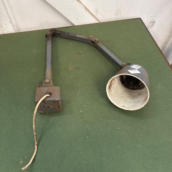 Vintage machinist lamp with folding arm, metal construction.