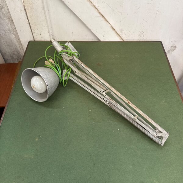 Vintage machinist lamp with adjustable metal arm.