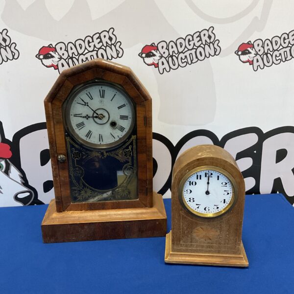 Two vintage mantle clocks, including a Junghans clock, in antique condition.