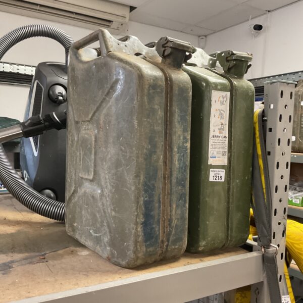Vintage metal jerry can, showing signs of wear and patina.