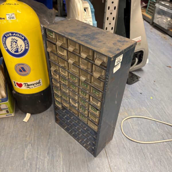 Vintage metal organiser cabinet with missing drawers, industrial style.