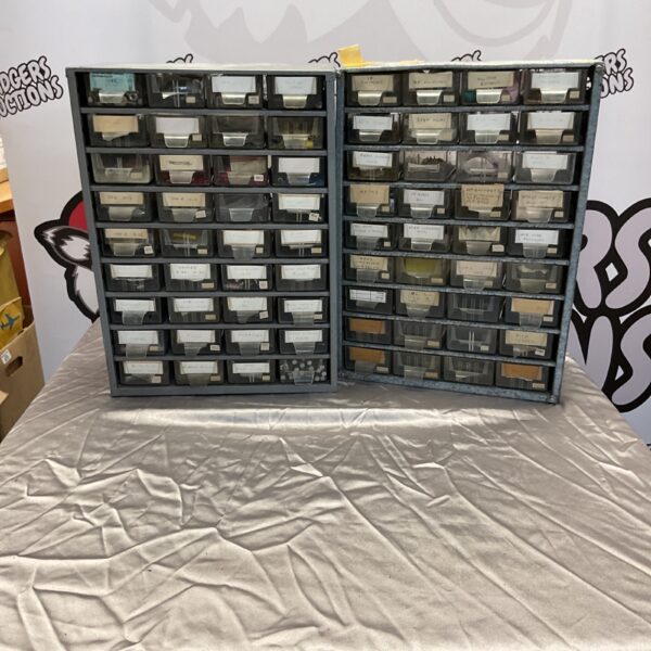 Vintage metal storage cabinet with labelled drawers, antique organizer.