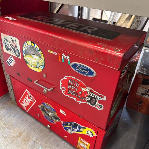 Red vintage metal tool boxes for garage storage and collection.