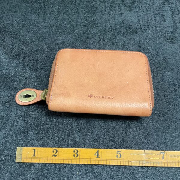 Vintage brown leather Mulberry purse with clasp closure.