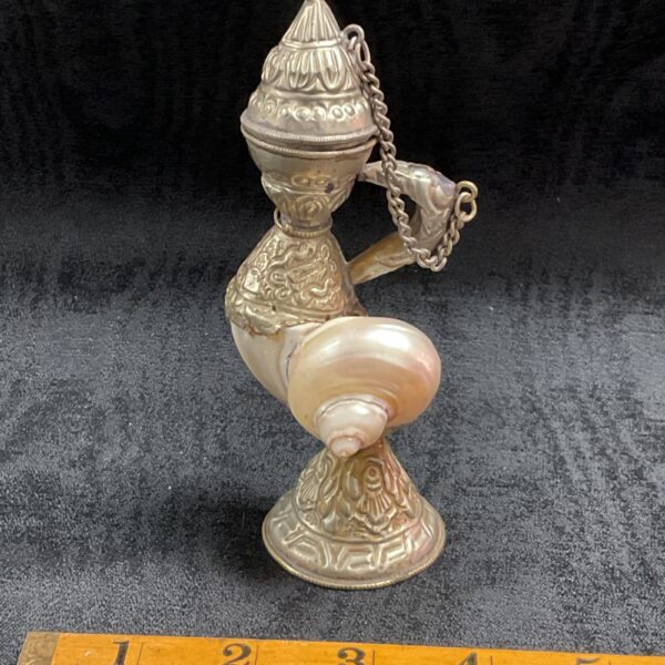 Vintage nautilus shell lamp with whitemetal base and chain.