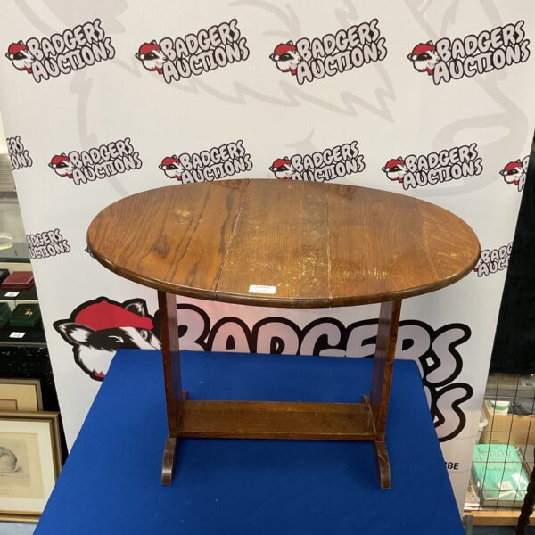 Vintage oak drop leaf table with turned legs.