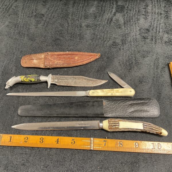 Vintage lot of three paper knives, including Dawson and Sons Ford dealer knives.