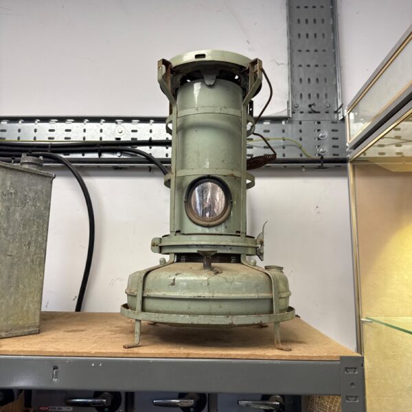 Vintage paraffin heater side view, antique greenhouse heating.