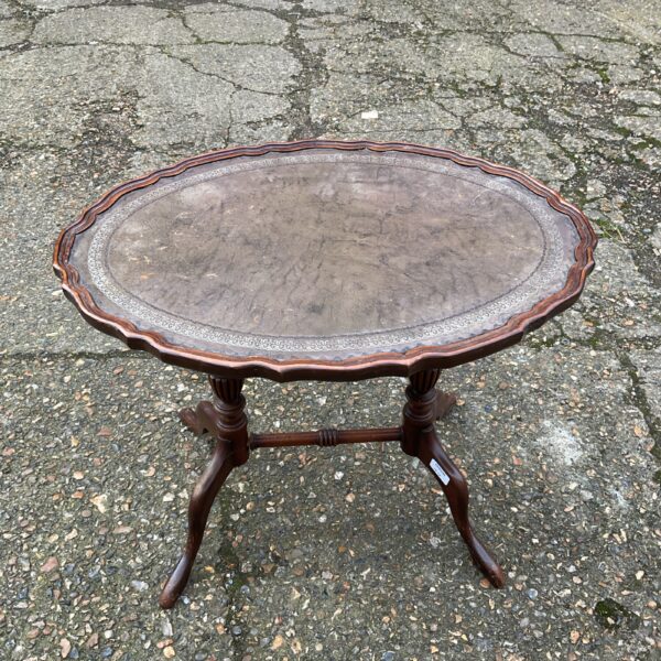 Vintage pie crust lamp table with leather top and mahogany legs.