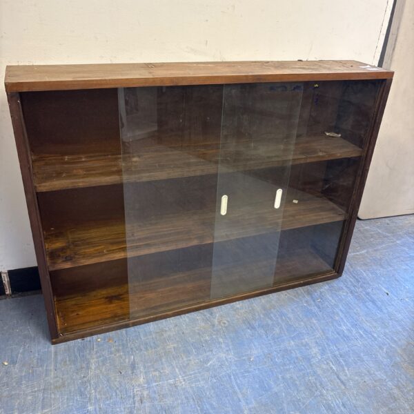Vintage pine display cabinet with glass front and shelving.