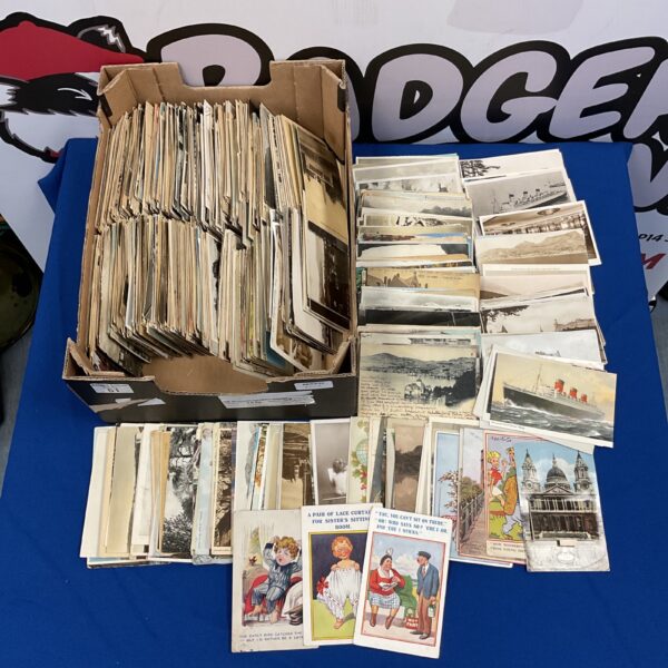 Large collection of vintage postcards with handwritten messages.