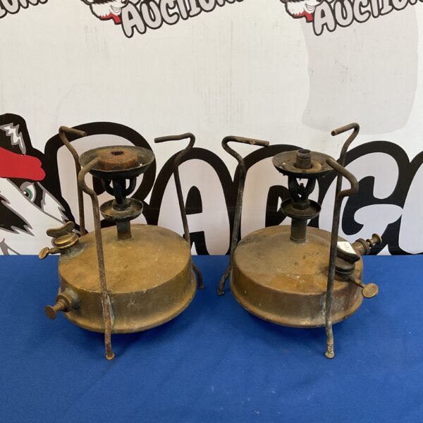 Two vintage Primus stoves with enamel finishes for outdoor cooking.