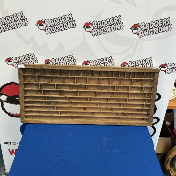 Vintage printers block with character grid for letterpress printing.