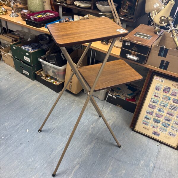 Vintage metal projector table with folding legs.