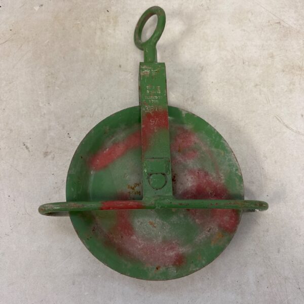 Vintage 1 ton pulley wheel for industrial or farm use.