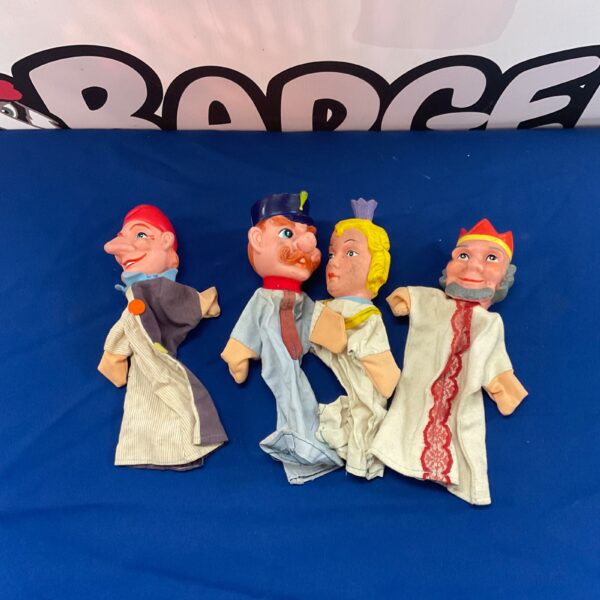 Group of vintage Punch and Judy hand puppets, collectible folk art toys.