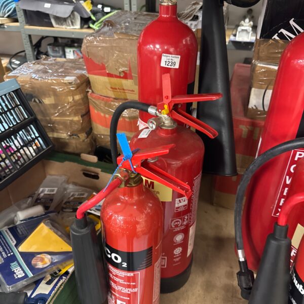 Vintage red fire extinguisher for collection or display.