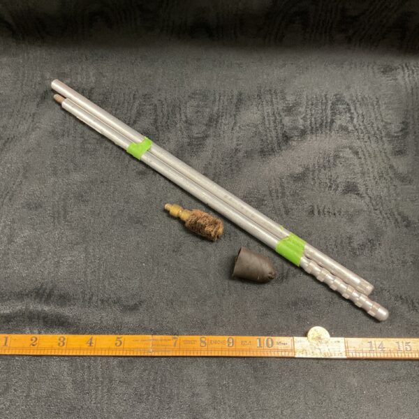 Vintage rifle cleaning rod with brush attachment.