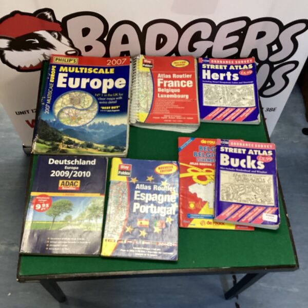 Vintage collection of road maps including France and Street Atlas.