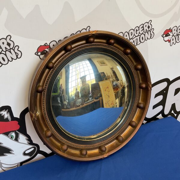 Vintage round mirror with a moulded frame, 42cm diameter.