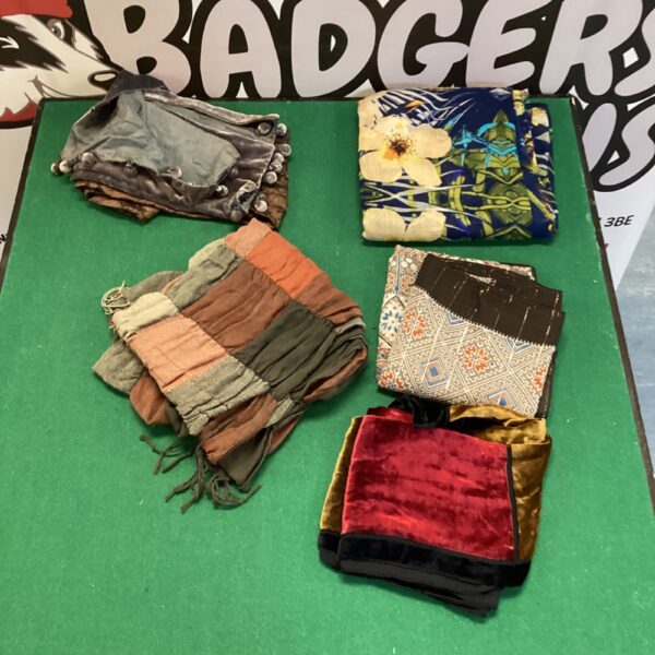 Vintage lot of five sarongs and throws with colourful patterns.