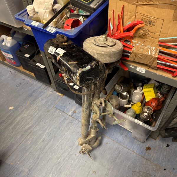 Vintage Seagull outboard motor showing wear and patina.