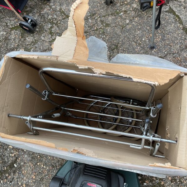 Vintage Silver Cross pram chassis in need of restoration.