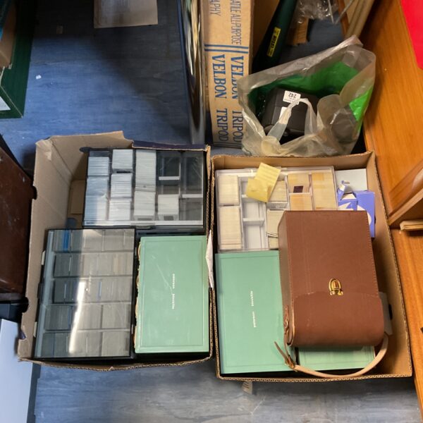 Vintage Noris 150-A slide projector with a collection of slides.