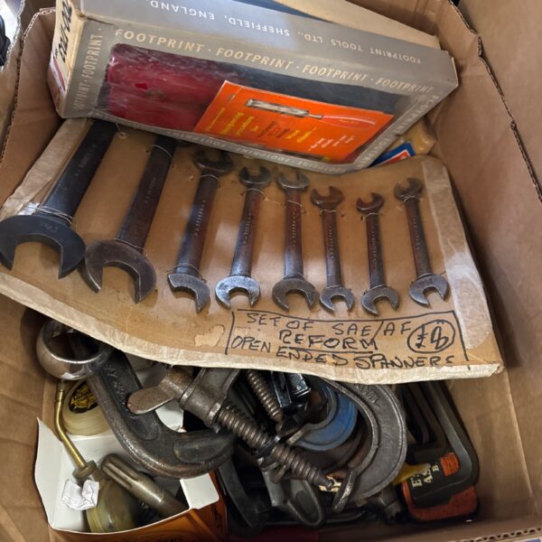 Vintage spanners in a Footprint box, ideal for tool collectors.