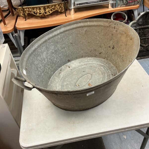Weathered vintage steel bucket for farmhouse or garden use.