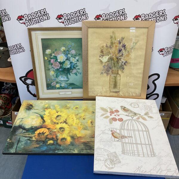 Vintage still life prints of flowers and birds in frames.