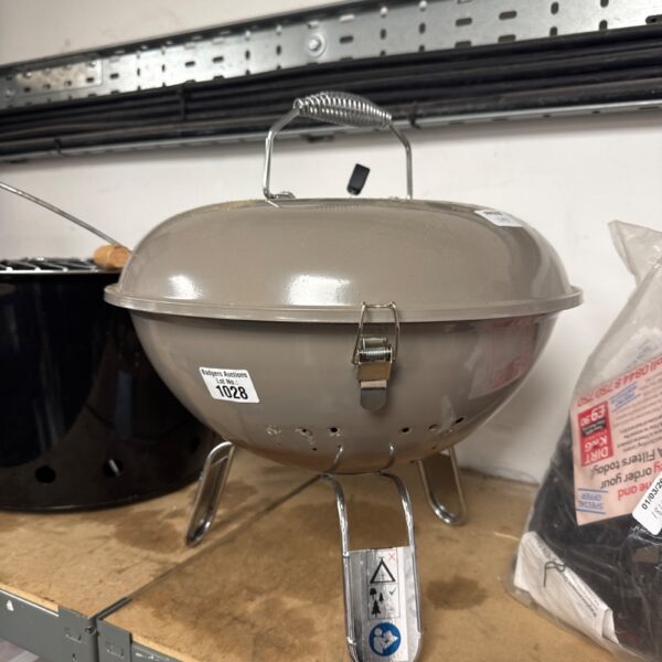 Vintage tabletop BBQ grill for picnics and outdoor cooking.