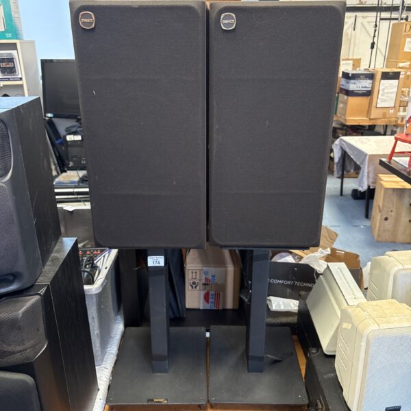Pair of vintage Tannoy speakers on stands, classic audio equipment.