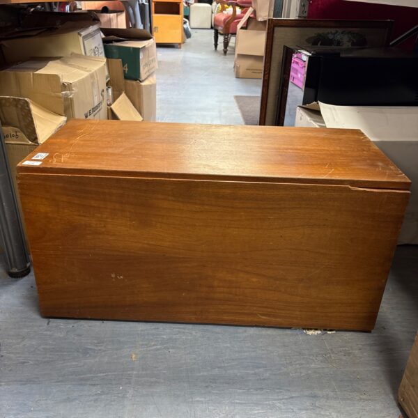 Vintage teak drop-door cabinet with a warm wood tone.