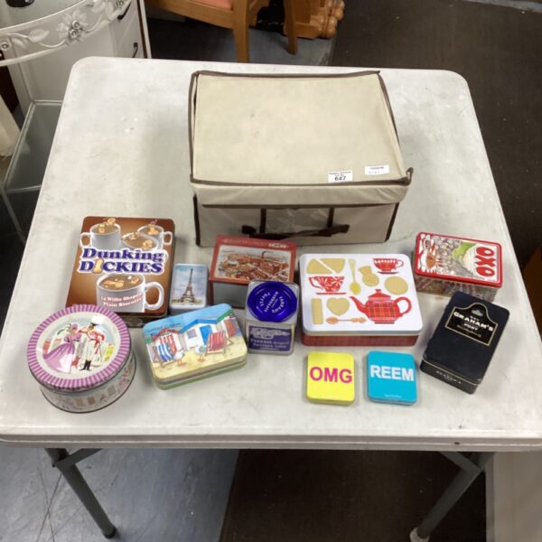 Vintage tin collection inside a fabric box, colourful biscuit tins.