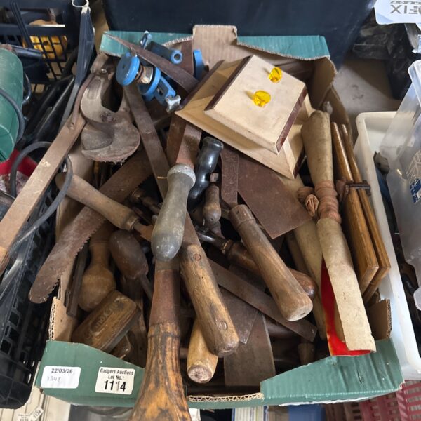 Vintage tool lot with hammers and chisels for restoration or collection.