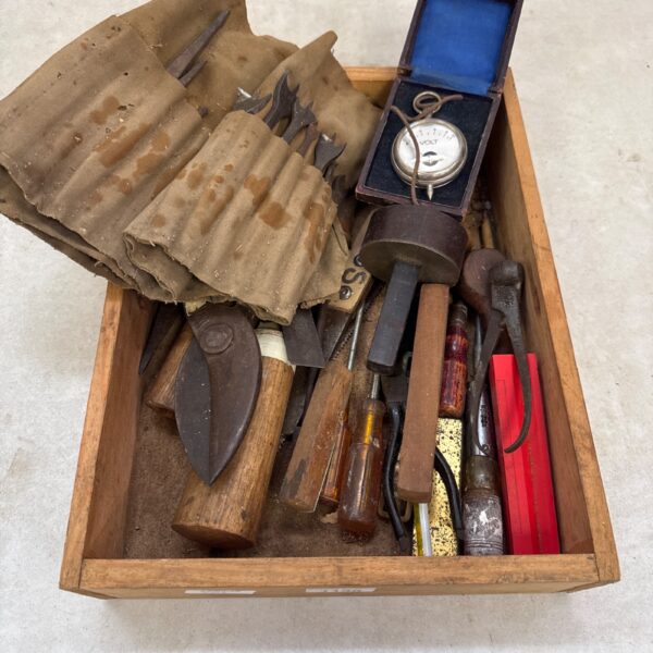 Vintage tool lot in wooden tray, antique hand tools collection.