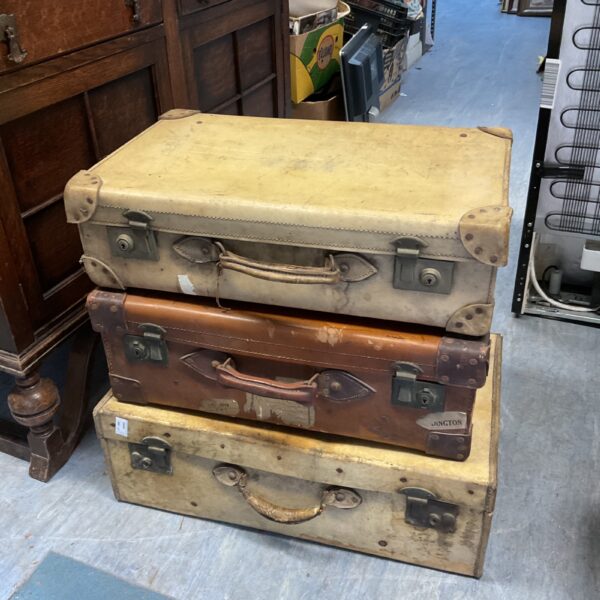 Lot of three vintage brown travel cases for collectors.