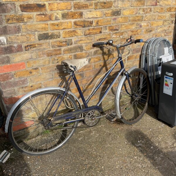 Blue vintage Triumph ladies bicycle, classic retro style.