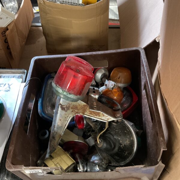 Vintage vehicle lighting components in a mixed lot.