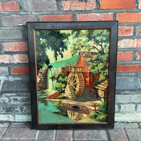 Vintage oil painting of a watermill in a scenic landscape.