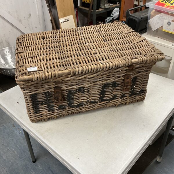 Vintage wicker basket with a traditional woven pattern.