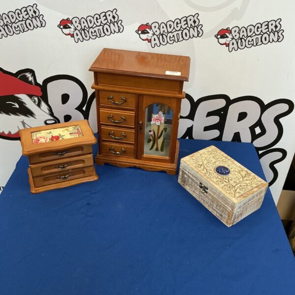 Three vintage wooden jewellery boxes for storage and display.