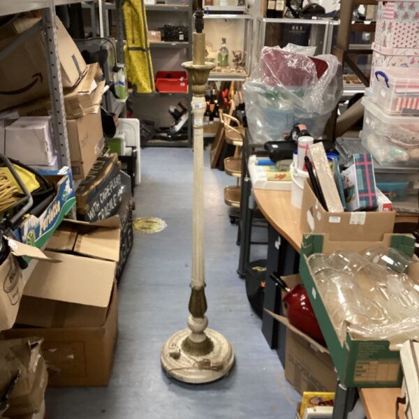 Tall vintage wooden standard lamp with carved details.