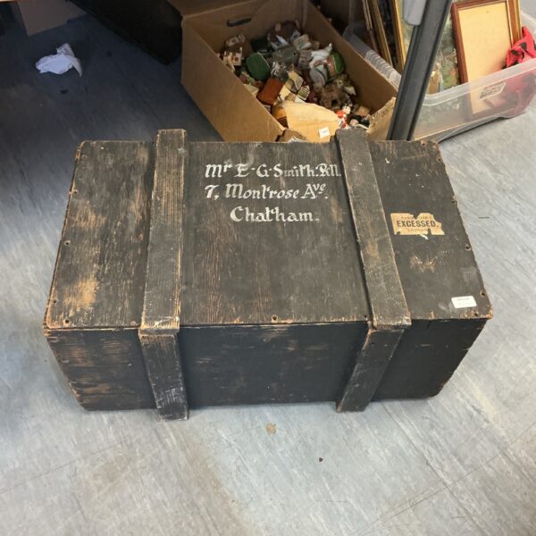 Vintage wooden storage box with inscription, rustic antique crate.