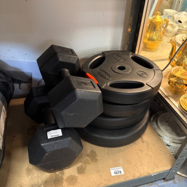 Vinyl dumbbells and weight plates for home fitness workouts.