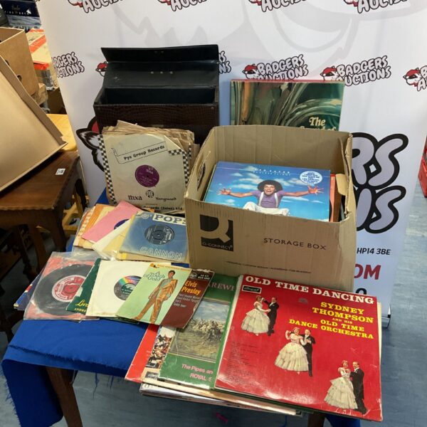Vintage vinyl record collection featuring Elvis Presley and Leo Sayer.