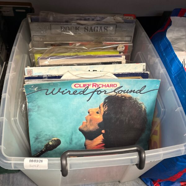 Box of mixed vinyl records for collectors and music lovers.