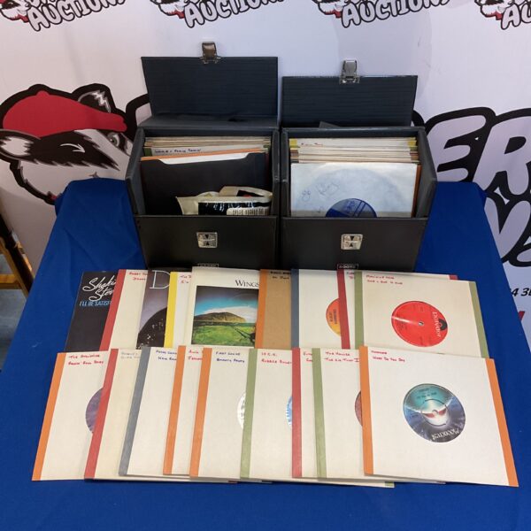 Vintage vinyl records collection featuring Wings singles.